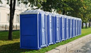 Line of porta potties near a curb